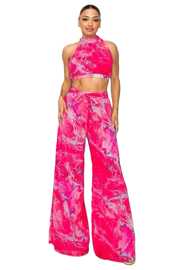 Woman wearing a pink and white tie-dye outfit on a white background