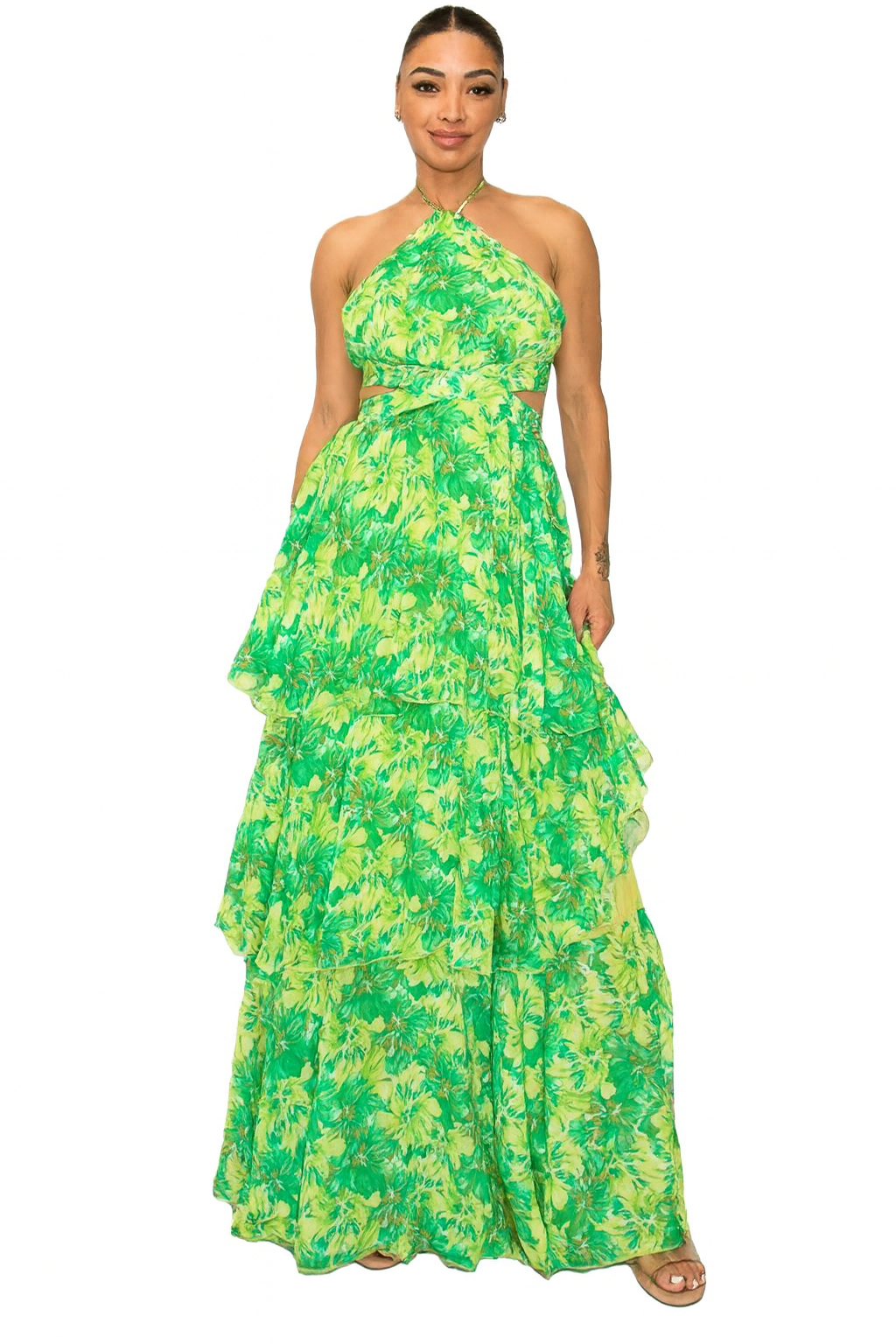 Woman wearing a green floral dress on a white background