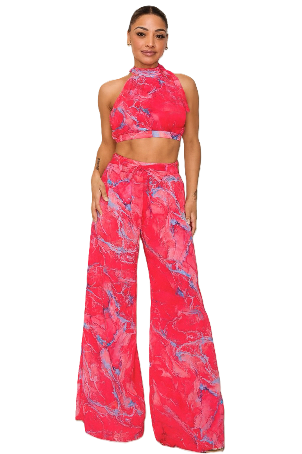 Woman wearing a pink and blue patterned outfit on a white background