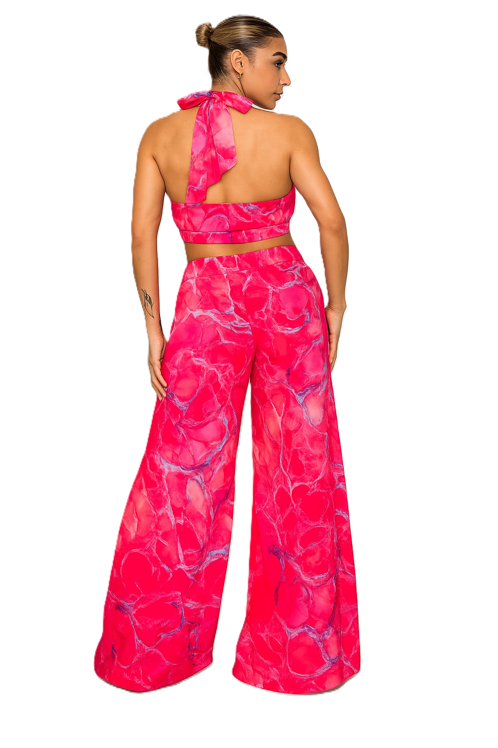 Woman wearing a pink and purple patterned outfit on a white background