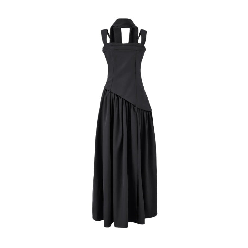 Black dress with unique strap design on a white background