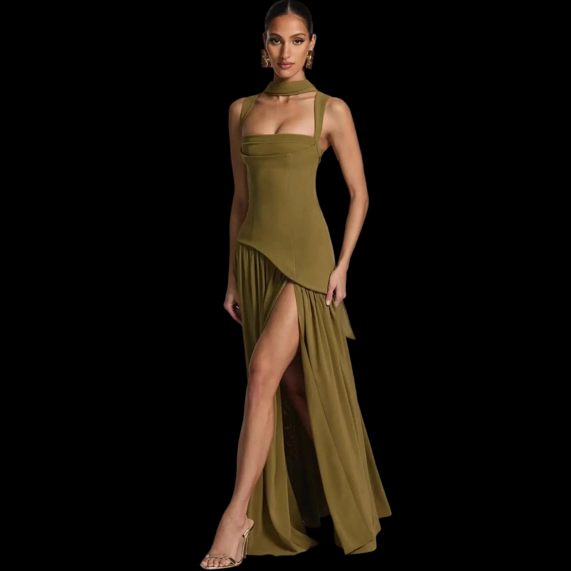 Woman wearing a green evening gown with a slit on a white background