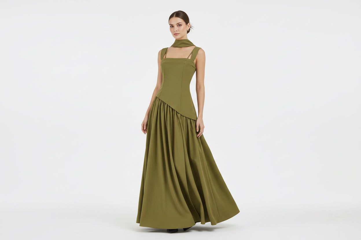 Green dress with cut-out straps on a white background
