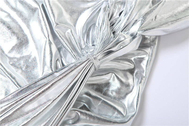Silver metallic fabric with folds on a white background